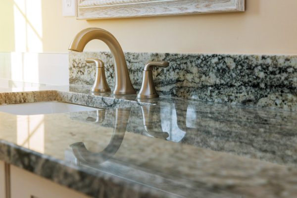 Counter top white marble bathroom interior with sink and faucet