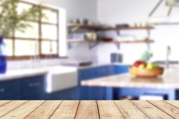 Empty wooden table with blurred vintage kitchen on background